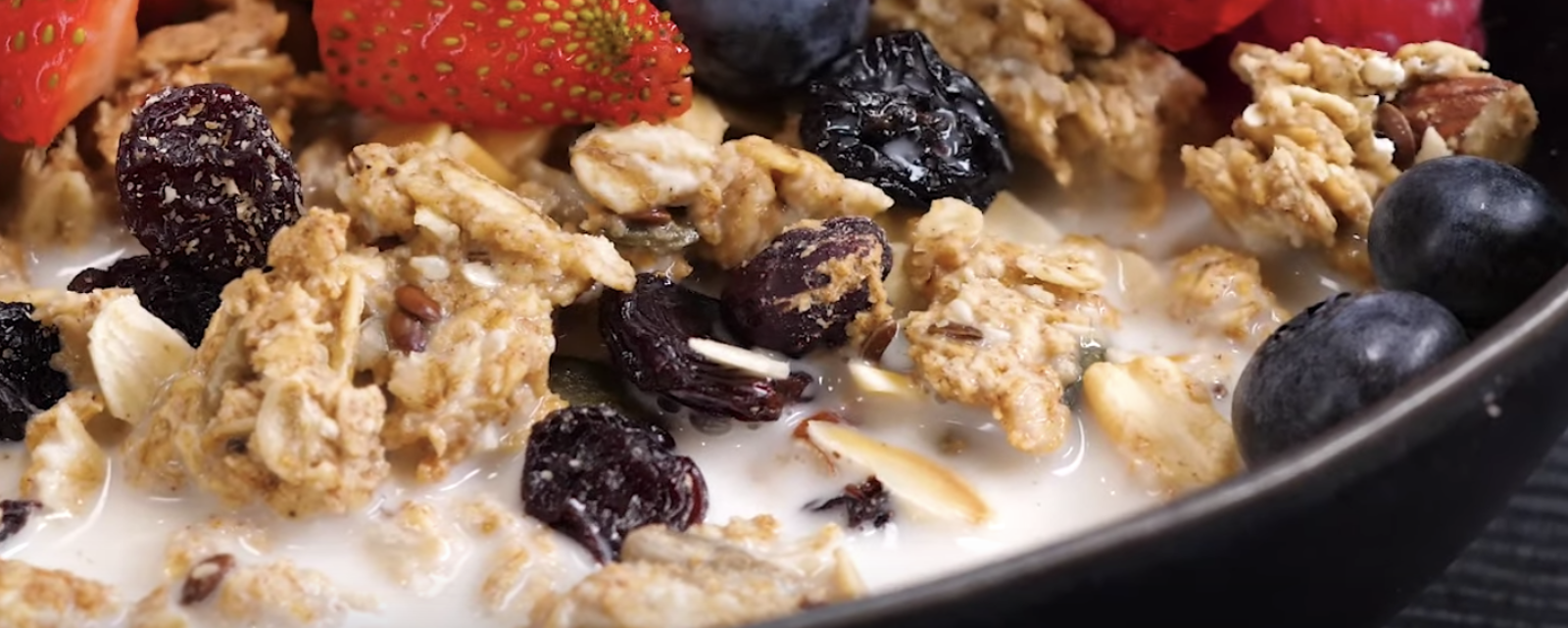 maple granola accompanied by 1 cup of unsweetened almond milk